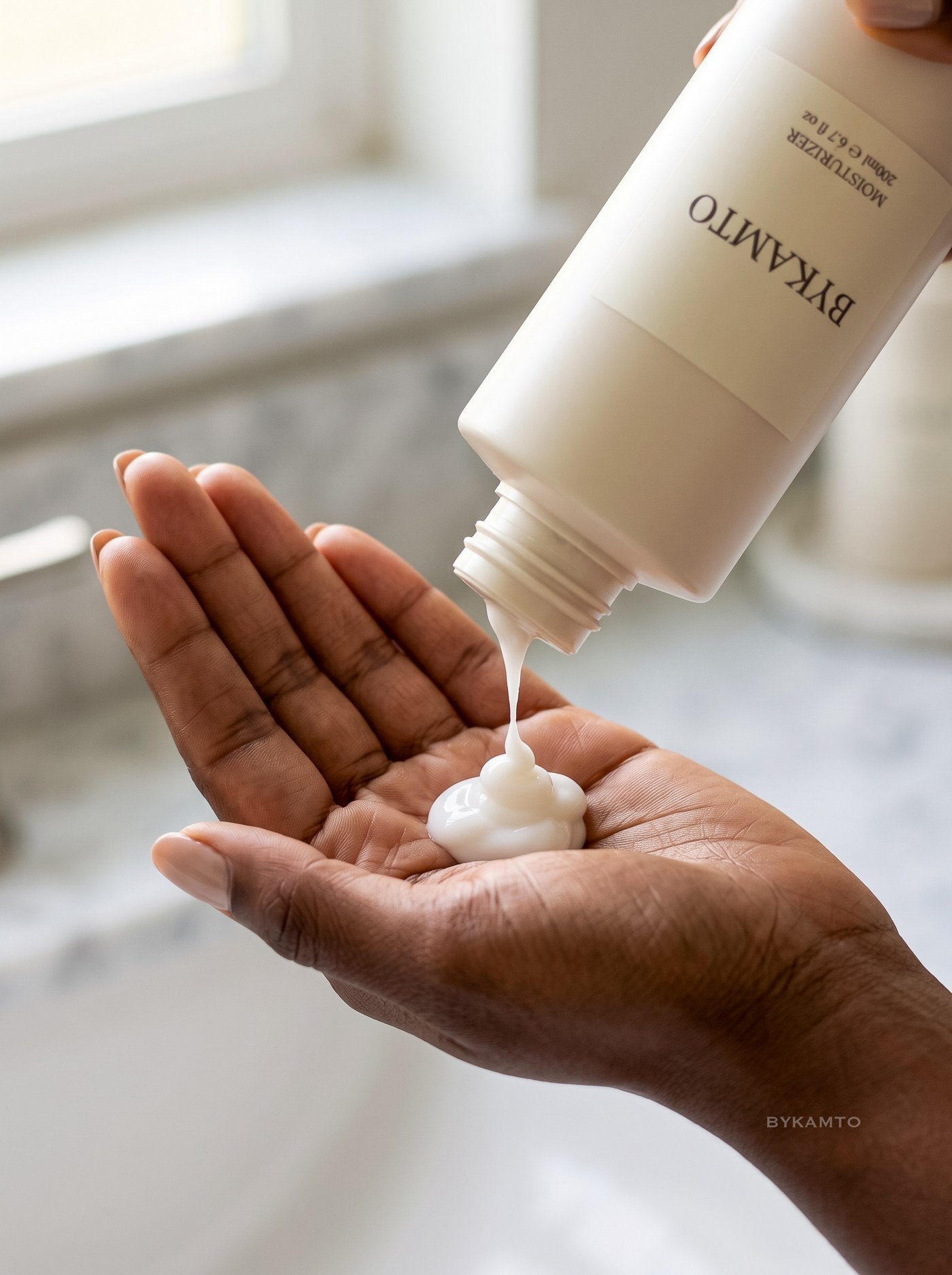 BYKAMTO skincare campaign — moisturizer poured into palm